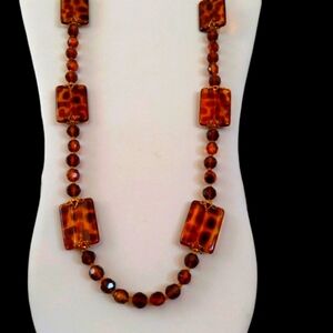 Joan Rivers long faux tortoise bead necklace